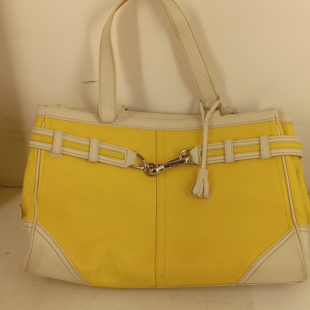 Yellow and white Coach Purse one zipper pocket inside & two small pockets inside